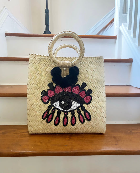 EVIL EYE STRAW POMPÓN BAG